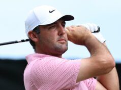 3 top pros agree on why Renaissance Club decides The Open winner Golfer wearing a white Nike cap and pink checkered shirt, holding a golf club over his shoulder against a blue sky.