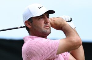 3 top pros agree on why Renaissance Club decides The Open winner Golfer wearing a white Nike cap and pink checkered shirt, holding a golf club over his shoulder against a blue sky.